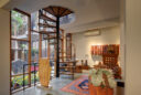 Living space, spiral stairs and studio ceramics at the Kubba residence, New Delhi