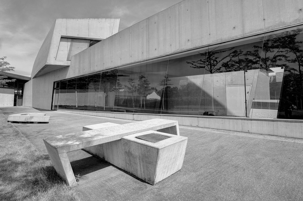A bench outside the fire station at Vitra Design museum by Zaha Hadid that mirrors the geometry of the building