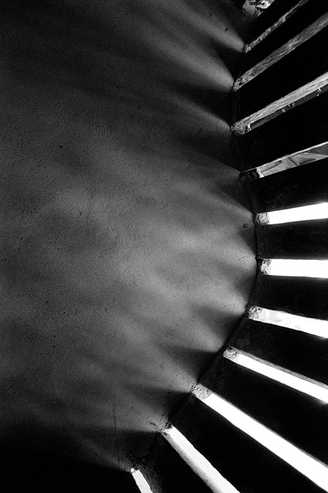 The curved trellised walls in a palace in Kerala cut down the harsh glare