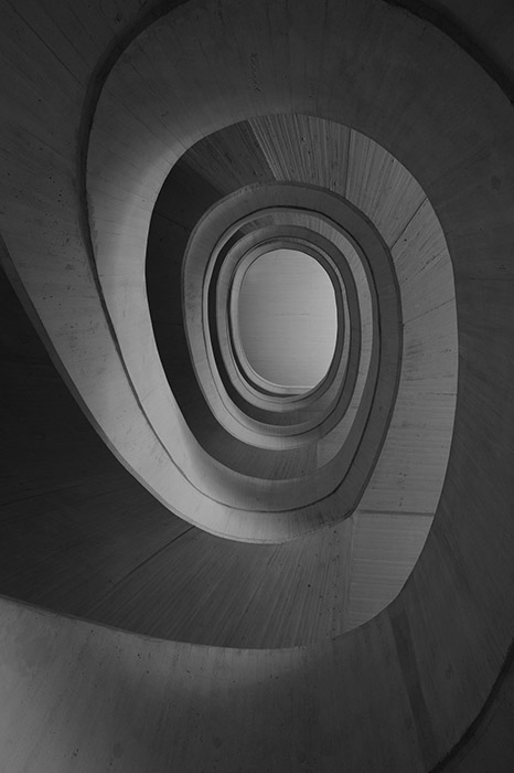 Exposed concrete spiral of a staircase in Valencia