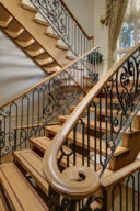 Timber staircase with wrought iron balustrade